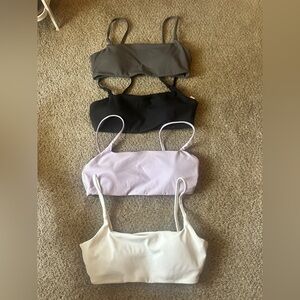 Pack of Sports Bras. White, Grey, Light Purple, and Black